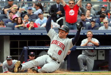 NEW YORK - MAY 17:  Nick Punto #8 of the Minnesota Twins scores a seventh inning run against the New York Yankees after a wild pitch on May 17, 2009 at Yankee Stadium in the Bronx borough of New York City.  (Photo by Jim McIsaac/Getty Images)