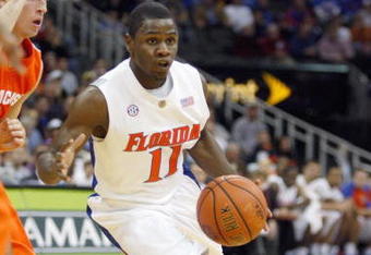 KANSAS CITY, MO - NOVEMBER 24: Erving Walker #11 of the Florida Gators drives the ball downcourt against the Syracuse Orange during the CBE Classic game on November 24, 2008 at the Sprint Center in Kansas City, Missouri. (Photo by Jamie Squire/Getty Images)