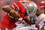 COLUMBUS, OH - SEPTEMBER 26:  Defensive end Clay Nurse #97 of the Illinois Fighting Illini hauls down quarterback Terrelle Pryor #2 of the Ohio State Buckeyes by his facemask at Ohio Stadium on September 26, 2009 in Columbus, Ohio. Nurse was assessed a facemasking penalty. (Photo by Jamie Sabau/Getty Images)