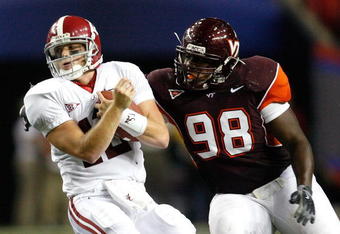 ATLANTA - SEPTEMBER 05:  Antoine Hopkins #98 of the Virginia Tech Hokies against quarterback Greg McElroy #12 of the Alabama Crimson Tide during the Chick-fil-A Kickoff Game at Georgia Dome on September 5, 2009 in Atlanta, Georgia.  (Photo by Kevin C. Cox/Getty Images)