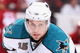 GLENDALE, AZ - SEPTEMBER 26:  Dany Heatley #15 of the San Jose Sharks leans in during a face off in the preseason NHL game against the Phoenix Coyotes at Jobing.com Arena on September 26, 2009 in Glendale, Arizona.  (Photo by Christian Petersen/Getty Images)