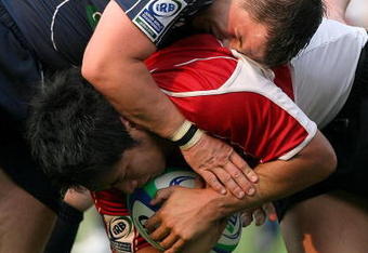 TOKYO - JUNE 13:  Finlay Gillies and Dougie Orr of Scotland tackle Kota Yamashita of Japan during the IRB Junior World Championship Japan 2009 match between Japan and Scotland at Prince Chichibu Stadium on June 13, 2009 in Tokyo, Japan.  (Photo by Kiyoshi Ota/Getty Images)