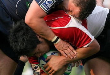 TOKYO - JUNE 13:  Finlay Gillies and Dougie Orr of Scotland tackle Kota Yamashita of Japan during the IRB Junior World Championship Japan 2009 match between Japan and Scotland at Prince Chichibu Stadium on June 13, 2009 in Tokyo, Japan.  (Photo by Kiyoshi Ota/Getty Images)