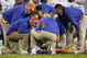 LEXINGTON, KY - SEPTEMBER 26: Quarterback Tim Tebow #15 of the Florida Gators is tended to by head coach Urban Meyer (R) and staff after Tebow was sacked by Taylor Wyndham #94 of the Kentucky Wildcats during the third quarter of the game at Commonwealth Stadium on September 26, 2009 in Lexington, Kentucky. (Photo by Andy Lyons/Getty Images)