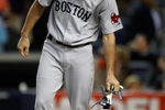 NEW YORK - SEPTEMBER 26: Josh Reddick #68 of the Boston Red Sox drops his gloves into his helmet after striking out looking during the game against the New York Yankees on September 26, 2009 at Yankee Stadium in the Bronx borough of New York City.  (Photo by Jared Wickerham/Getty Images)