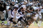 OAKLAND, CA - SEPTEMBER 27: Justin Fargas #25 of the Oakland Raiders is tackled by Andra Davis #54 of the Denver Broncos on September 27, 2009 during an NFL game at the Oakland-Alameda County Coliseum in Oakland, California.  (Photo by Jed Jacobsohn/Getty Images)