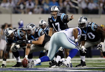 ARLINGTON, TX - SEPTEMBER 28:  Jake Delhomme #17 of the Carolina Panthers calls a play under center against the Dallas Cowboys at Cowboys Stadium on September 28, 2009 in Arlington, Texas.  (Photo by Ronald Martinez/Getty Images)