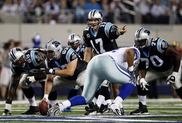 ARLINGTON, TX - SEPTEMBER 28:  Jake Delhomme #17 of the Carolina Panthers calls a play under center against the Dallas Cowboys at Cowboys Stadium on September 28, 2009 in Arlington, Texas.  (Photo by Ronald Martinez/Getty Images)