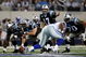 ARLINGTON, TX - SEPTEMBER 28: Jake Delhomme #17 of the Carolina Panthers calls a play under center against the Dallas Cowboys at Cowboys Stadium on September 28, 2009 in Arlington, Texas. (Photo by Ronald Martinez/Getty Images)