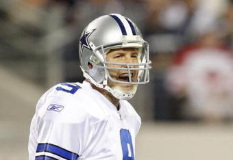 ARLINGTON, TX - SEPTEMBER 28:  Tony Romo #9 of the Dallas Cowboys calls a play gainst the Carolina Panthers at Cowboys Stadium on September 28, 2009 in Arlington, Texas. (Photo by Ronald Martinez/Getty Images)