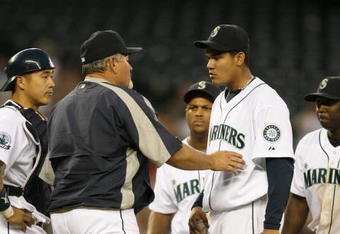 SEATTLE - MAY 15:  Starting pitcher Felix Hernandez #34 of the Seattle Mariners is removed from the game by manager Mike Hargrove #21 in the fourth inning against the Los Angeles Angels of Anahiem on May 15, 2007 at Safeco Field in Seattle, Washington.  (Photo by Otto Greule Jr/Getty Images)