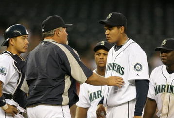 SEATTLE - MAY 15:  Starting pitcher Felix Hernandez #34 of the Seattle Mariners is removed from the game by manager Mike Hargrove #21 in the fourth inning against the Los Angeles Angels of Anahiem on May 15, 2007 at Safeco Field in Seattle, Washington.  (Photo by Otto Greule Jr/Getty Images)