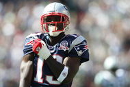 EAST RUTHERFORD, NJ - SEPTEMBER 20:  Joey Galloway #13 of the New England Patriots grabs his jersey against the New York Jets at Giants Stadium on September 20, 2009 in East Rutherford, New Jersey.  (Photo by Nick Laham/Getty Images)