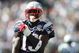EAST RUTHERFORD, NJ - SEPTEMBER 20:  Joey Galloway #13 of the New England Patriots grabs his jersey against the New York Jets at Giants Stadium on September 20, 2009 in East Rutherford, New Jersey.  (Photo by Nick Laham/Getty Images)