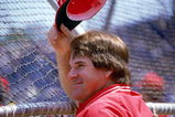 CHICAGO - 1987:  Manager Pete Rose #14 of the Cincinnati Reds tips his cap while watching batting practice before the MLB game against the Chicago Cubs at Wrigley Field during the 1987 season in Chicago, Illinois.  (Photo by Jonathan Daniel/Getty Images)   