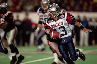 26 Nov 2000: Anthony Calvillo #13 of the Montreal Alouettes runs with the ball during the Grey Cup 2000 game against the British Columbia Lions at the McMahon Stadium in Calgary, Alberta, Canada. The Lions defeated the Alouettes 28-26.Mandatory Credit: Craig Klem /Allsport