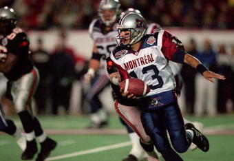 26 Nov 2000:  Anthony Calvillo #13 of the Montreal Alouettes runs with the ball during the Grey Cup 2000 game against the British Columbia Lions at the McMahon Stadium in Calgary, Alberta, Canada. The Lions defeated the Alouettes 28-26.Mandatory Credit: Craig Klem /Allsport