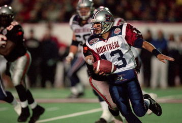 26 Nov 2000:  Anthony Calvillo #13 of the Montreal Alouettes runs with the ball during the Grey Cup 2000 game against the British Columbia Lions at the McMahon Stadium in Calgary, Alberta, Canada. The Lions defeated the Alouettes 28-26.Mandatory Credit: Craig Klem /Allsport