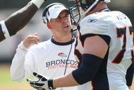 OAKLAND, CA - SEPTEMBER 27: Head coach Josh McDaniels of the Denver Broncos talks with Brandon Gorin #77 against the Oakland Raiders on September 27, 2009 during an NFL game at the Oakland-Alameda County Coliseum in Oakland, California. (Photo by Jed Jacobsohn/Getty Images)