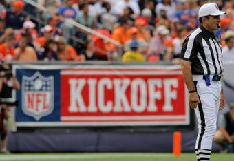 DENVER - SEPTEMBER 20:  Referee Pete Morelli and the Denver Broncos during NFL action at Invesco Field at Mile High on September 20, 2009 in Denver, Colorado. The Broncos defeated the Browns 27-6.  (Photo by Doug Pensinger/Getty Images)