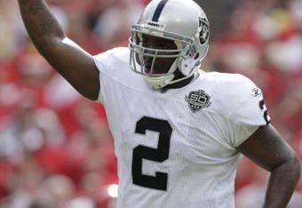 KANSAS CITY, MO - SEPTEMBER 20:  JaMarcus Russell #2 of the Oakland Raiders points to the sky in celebration during the game against the Kansas City Chiefs at Arrowhead Stadium on September 20, 2009 in Kansas City, Missouri. (Photo by Jamie Squire/Getty Images)