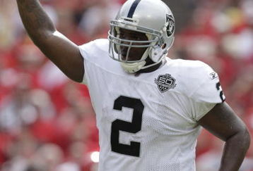 KANSAS CITY, MO - SEPTEMBER 20:  JaMarcus Russell #2 of the Oakland Raiders points to the sky in celebration during the game against the Kansas City Chiefs at Arrowhead Stadium on September 20, 2009 in Kansas City, Missouri. (Photo by Jamie Squire/Getty Images)