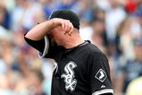 CHICAGO - JUNE 18: Scott Linebrink#71 of the Chicago White Sox reacts after giving up a three-run home run to Derrek Lee of the Chicago Cubs in the 8th inning on June 18, 2009 at Wrigley Field in Chicago, Illinois. The Cubs defeated the White Sox 6-5. (Photo by Jonathan Daniel/Getty Images)