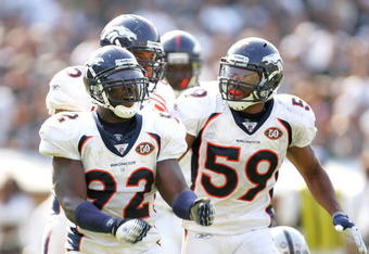 OAKLAND, CA - SEPTEMBER 27:   Wesley Woodyard #59 congratulates Elvis Dumervil #92 of the Denver Broncos after Dumervil sacked JaMarcus Russell of the Oakland Raiders at the Oakland-Alameda County Coliseum on September 27, 2009 in Oakland, California.  (Photo by Ezra Shaw/Getty Images)