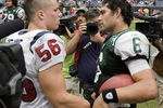 HOUSTON - SEPTEMBER 13:  Linebacker Brian Cushing #56 of the Houston Texans congratulates quarterback Mark Sanchez #6 of the New York Jets after the Jets defeated the Texans 24-7 at Reliant Stadium on September 13, 2009 in Houston, Texas. Cushing and Sanchez were roommates and teammates at USC.  (Photo by Bob Levey/Getty Images)