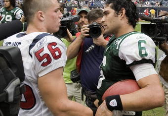 HOUSTON - SEPTEMBER 13:  Linebacker Brian Cushing #56 of the Houston Texans congratulates quarterback Mark Sanchez #6 of the New York Jets after the Jets defeated the Texans 24-7 at Reliant Stadium on September 13, 2009 in Houston, Texas. Cushing and Sanchez were roommates and teammates at USC.  (Photo by Bob Levey/Getty Images)