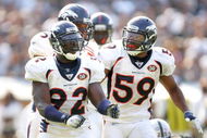 OAKLAND, CA - SEPTEMBER 27: Wesley Woodyard #59 congratulates Elvis Dumervil #92 of the Denver Broncos after Dumervil sacked JaMarcus Russell of the Oakland Raiders at the Oakland-Alameda County Coliseum on September 27, 2009 in Oakland, California. (Photo by Ezra Shaw/Getty Images)