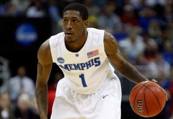 KANSAS CITY, MO - MARCH 21:  Willie Kemp #1 of the Memphis Tigers looks to make a play on the dribble during their second round game against the Maryland Terrapins in the NCAA Division I Men's Basketball Tournament at the Sprint Center on March 21, 2009 in Kansas City, Missouri. The Tigers defeated the Terrapins 89-70.  (Photo by Jamie Squire/Getty Images)