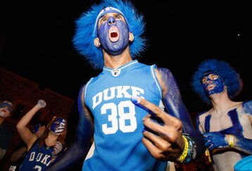 DURHAM, NC - FEBRUARY 11: Duke Blue Devils students decorate themselves with paint prior to the start of the annual showdown with the North Carolina Tar Heels in a makeshift campsite known as Krzyzewskiville on February 11, 2009 at Cameron Indoor Stadium in Durham, North Carolina. (Photo by Kevin C. Cox/Getty Images)