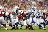 GLENDALE, AZ - SEPTEMBER 27:  Running back Tim Hightower #34 of the Arizona Cardinals is tackled for a loss by Ed Johnson #92 of the Indianapolis Colts in the second quarter during the game at University of Phoenix Stadium on September 27, 2009 in Glendale, Arizona. (Photo by Christian Petersen/Getty Images)
