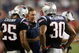 FOXBORO, MA - AUGUST 20: Head coach Bill Belichick of the New England Patriots talks with Pat Chung #25 and Brandon McGowan #30 against the Cincinnati Bengals during their preseason game at Gillette Stadium on August 20, 2009 in Foxboro, Massachusetts. (Photo by Jim Rogash/Getty Images)