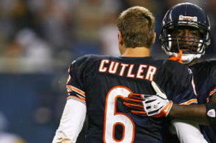 CHICAGO - SEPTEMBER 20: Charles Tillman #33 of the Chicago Bears hugs teammate Jay Cutler #6 after a win over the Pittsburgh Steelers on September 20, 2009 at Soldier Field in Chicago, Illinois. The Bears defeated the Steelers 17-14. (Photo by Jonathan Daniel/Getty Images)