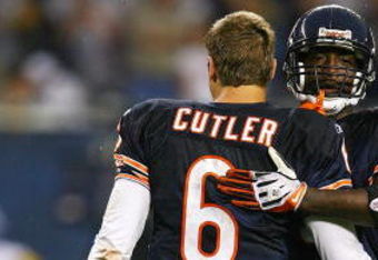 CHICAGO - SEPTEMBER 20: Charles Tillman #33 of the Chicago Bears hugs teammate Jay Cutler #6 after a win over the Pittsburgh Steelers on September 20, 2009 at Soldier Field in Chicago, Illinois. The Bears defeated the Steelers 17-14. (Photo by Jonathan Daniel/Getty Images)