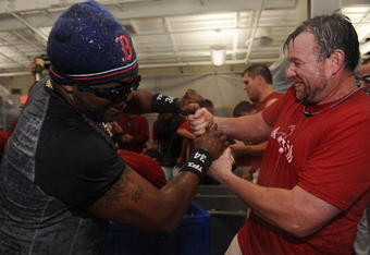 BOSTON - SEPTEMBER 23:  Sean Casey #22 and David Ortiz #34 of the Boston Red Sox celebrate in the locker room with after the 5-4 win over the Cleveland Indians clinched the Red Sox the Wild Card on September 23, 2008 at Fenway Park in Boston, Massachusetts.  (Photo by Michael Ivins-Pool/Getty Images)
