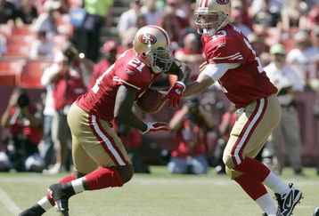 SAN FRANCISCO - SEPTEMBER 20:  Running back Frank Gore #21 of the San Francisco 49ers gets a hand off from quarterback Shaun Hill #13 and runs for a touchdown against the Seattle Seahawks in the first quarter during the home opener at Candlestick Park on September 20, 2009 in San Francisco, California.  (Photo by David Paul Morris/Getty Images)