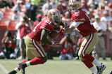 SAN FRANCISCO - SEPTEMBER 20:  Running back Frank Gore #21 of the San Francisco 49ers gets a hand off from quarterback Shaun Hill #13 and runs for a touchdown against the Seattle Seahawks in the first quarter during the home opener at Candlestick Park on September 20, 2009 in San Francisco, California.  (Photo by David Paul Morris/Getty Images)