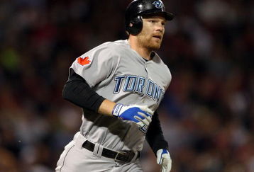 BOSTON - SEPTEMBER 29:  Adam Lind #26 of the Toronto Blue Jays rounds first base after his solo home run in the seventh inning against the Boston Red Sox on September 29, 2009 at Fenway Park in Boston, Massachusetts. It was Lind's third home run of the game.  (Photo by Elsa/Getty Images)