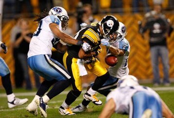PITTSBURGH, PA - SEPTEMBER 10: Wide receiver Hines Ward #86 of the Pittsburgh Steelers fumbles the football against the Tennessee Titans at Heinz Field on September 10, 2009 in Pittsburgh, Pennsylvania. The Steelers defeated the Titans 13-10 in overtime. (Photo by Scott Boehm/Getty Images)