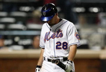NEW YORK - SEPTEMBER 23:  Daniel Murphy #28 of the New York Mets walks to the dugout after striking out against the Atlanta Braves during the game on September 23, 2009 at Citi Field in the Flushing neighborhood of the Queens borough of New York City.  (Photo by Jared Wickerham/Getty Images)