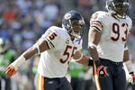 SEATTLE - SEPTEMBER 27: Lance Briggs #55 of the Chicago Bears moves on the field as Adewale Ogunleye #93 looks on during the game against the Seattle Seahawks on September 27, 2009 at Qwest Field in Seattle, Washington. The Bears defeated the Seahawks 25-19.  (Photo by Otto Greule Jr/Getty Images)   