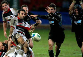 GLASGOW, UNITED KINGDOM - JANUARY 18: Glen Jackson of Saracens clears the ball during  Heineken Cup match against Glasgow Warriors at Firhill Stadium January 18, 2007 in Glasgow , Scotland.  (Photo by Jeff J Mitchell/Getty Images)