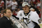 DETROIT - JUNE 12: Sidney Crosby #87 of the Pittsburgh Penguins celebrates with the Stanley Cup following the Penguins victory over the Detroit Red Wings in Game Seven of the 2009 NHL Stanley Cup Finals at Joe Louis Arena on June 12, 2009 in Detroit, Michigan. (Photo by Bruce Bennett/Getty Images)