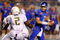 BOISE, ID - SEPTEMBER 3:  Kellen Moore #11 of the Boise State throws a pass under pressure by T.J. Ward #2 of the Oregon Ducks in second quarter of the game on September 3, 2009 at Broncos Stadium in Boise, Idaho. Boise State won the game 19-8. (Photo by Steve Dykes/Getty Images)