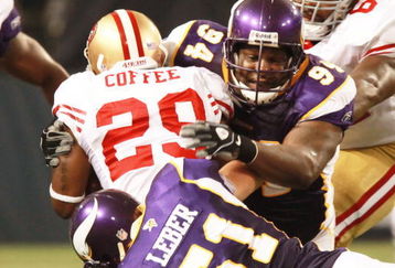 MINNEAPOLIS, MN - SEPTEMBER 27: Glen Coffee #29 of the San Francisco 49ers is stopped by Ben Leber #51 of the Minnesota Vikings along with teammate Pat Williams #94 at Hubert H. Humphrey Metrodome on September 27, 2009 in Minneapolis, Minnesota. The Vikings defeated the 49ers 27-24. (Photo by Genevieve Ross/Getty Images)