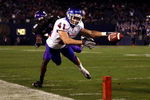 SAN DIEGO, CA - DECEMBER 23:  Runningback Ian Johnson #41 of the Boise State Broncos dives for the endzone pilon against the defense of Cornerback Rafael Priest #10 of TCU during the San Diego County Credit Union Poinsettia Bowl at Qualcomm Stadium on December 23, 2008 in San Diego, California. (Photo by Donald Miralle/Getty Images)
