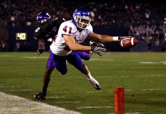 SAN DIEGO, CA - DECEMBER 23:  Runningback Ian Johnson #41 of the Boise State Broncos dives for the endzone pilon against the defense of Cornerback Rafael Priest #10 of TCU during the San Diego County Credit Union Poinsettia Bowl at Qualcomm Stadium on December 23, 2008 in San Diego, California. (Photo by Donald Miralle/Getty Images)